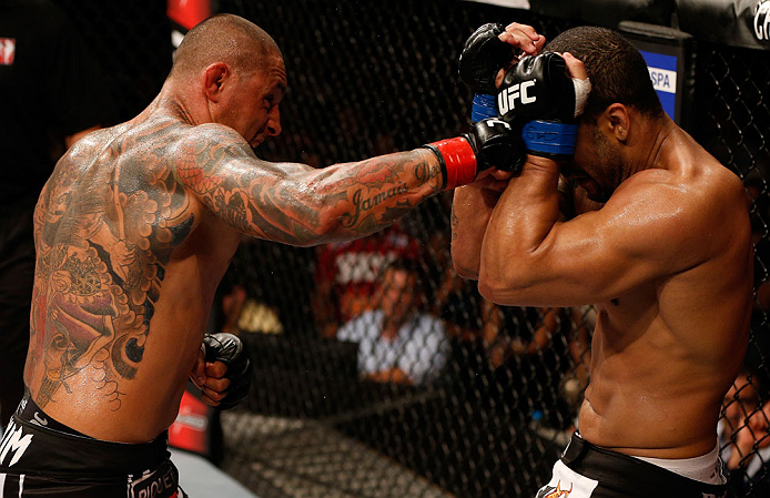 FORTALEZA, BRAZIL - JUNE 08: (L-R) Thiago Silva punches Rafael "Feijao" Cavalcante in their light heavyweight fight during the UFC on FUEL TV event at Paulo Sarasate Arena on June 8, 2013 in Fortaleza, Ceara, Brazil. (Photo by Josh Hedges/Zuffa LLC/Zuff