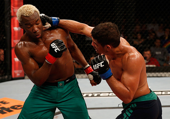 FORTALEZA, BRAZIL - JUNE 08: (R-L) Leonardo Santos punches William "Patolino" Macario in their welterweight fight during the UFC on FUEL TV event at Paulo Sarasate Arena on June 8, 2013 in Fortaleza, Ceara, Brazil. (Photo by Josh Hedges/Zuffa LLC/Zuffa