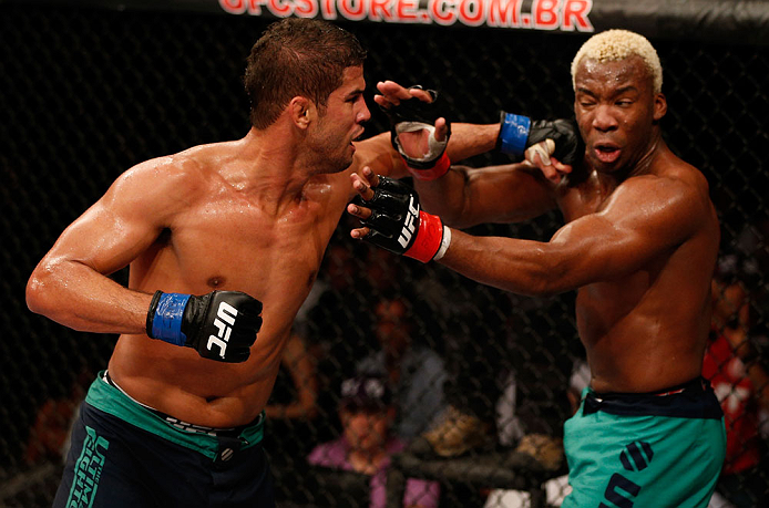 FORTALEZA, BRAZIL - JUNE 08: (L-R) Leonardo Santos punches William "Patolino" Macario in their welterweight fight during the UFC on FUEL TV event at Paulo Sarasate Arena on June 8, 2013 in Fortaleza, Ceara, Brazil. (Photo by Josh Hedges/Zuffa LLC/Zuffa