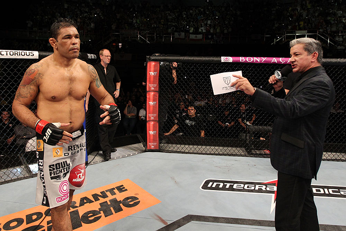 FORTALEZA, BRAZIL - JUNE 08: Antonio Rodrigo "Minotauro" Nogueira (L) is introduced by Bruce Buffer before his heavyweight fight against Fabricio Werdum during the UFC on FUEL TV event at Paulo Sarasate Arena on June 8, 2013 in Fortaleza, Ceara, Brazil.