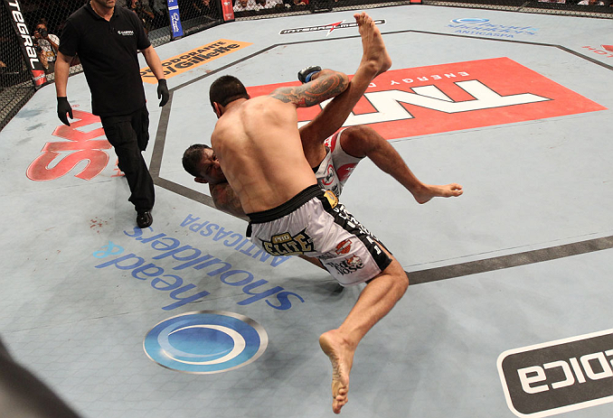 FORTALEZA, BRAZIL - JUNE 08: (L-R) Fabricio Werdum takes down Antonio Rodrigo "Minotauro" Nogueira in their heavyweight fight during the UFC on FUEL TV event at Paulo Sarasate Arena on June 8, 2013 in Fortaleza, Ceara, Brazil. (Photo by Josh Hedges/Zuff