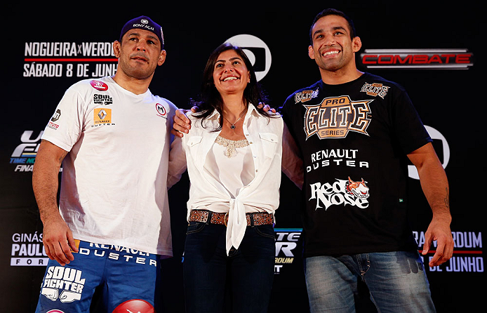 FORTALEZA, BRAZIL - JUNE 06: Opponents Antonio Rodrigo "Minotauro" Nogueira (L) and Fabricio Werdum pose for photos with UFC vice president Grace Tourinho at Centro de Eventos do Ceara on June 6, 2013 in Fortaleza, Ceara, Brazil. (Photo by Josh Hedges/Z