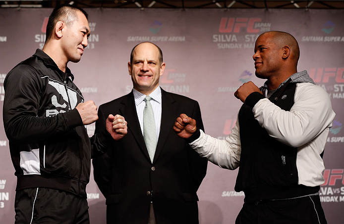 TOKYO, JAPAN - FEBRUARY 28: (L-R) Opponents Yushin Okami and Hector Lombard face off during a UFC press conference at the Hilton Sjinjuku Hotel on February 28, 2013 in Tokyo, Japan. (Photo by Josh Hedges/Zuffa LLC/Zuffa LLC via Getty Images)