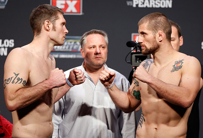 GOLD COAST, AUSTRALIA - DECEMBER 14: (L-R) Opponents Nick Penner and Cody Donovan face off during the UFC on FX weigh in on December 14, 2012 at Gold Coast Convention and Exhibition Centre in Gold Coast, Queensland, Australia. (Photo by Josh Hedges/Zuff