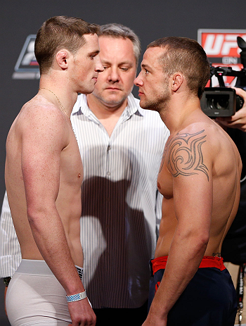 GOLD COAST, AUSTRALIA - DECEMBER 14: (L-R) Opponents Brendan Loughnane and Mike Wilkinson face off during the UFC on FX weigh in on December 14, 2012 at Gold Coast Convention and Exhibition Centre in Gold Coast, Queensland, Australia. (Photo by Josh Hed