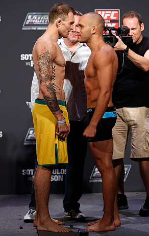 GOLD COAST, AUSTRALIA - DECEMBER 14: (L-R) Opponents Benny Alloway and Manuel Rodriguez face off during the UFC on FX weigh in on December 14, 2012 at Gold Coast Convention and Exhibition Centre in Gold Coast, Queensland, Australia. (Photo by Josh Hedge