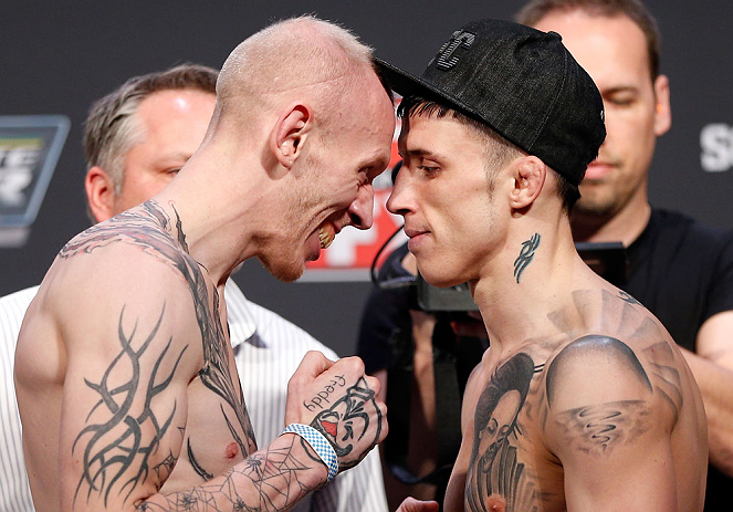 GOLD COAST, AUSTRALIA - DECEMBER 14: (L-R) Opponents Colin Fletcher and Norman Parke face off during the UFC on FX weigh in on December 14, 2012 at Gold Coast Convention and Exhibition Centre in Gold Coast, Queensland, Australia. (Photo by Josh Hedges/Z