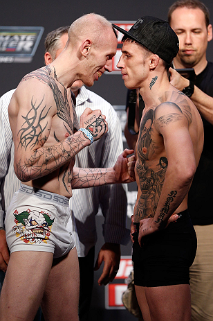 GOLD COAST, AUSTRALIA - DECEMBER 14: (L-R) Opponents Colin Fletcher and Norman Parke face off during the UFC on FX weigh in on December 14, 2012 at Gold Coast Convention and Exhibition Centre in Gold Coast, Queensland, Australia. (Photo by Josh Hedges/Z