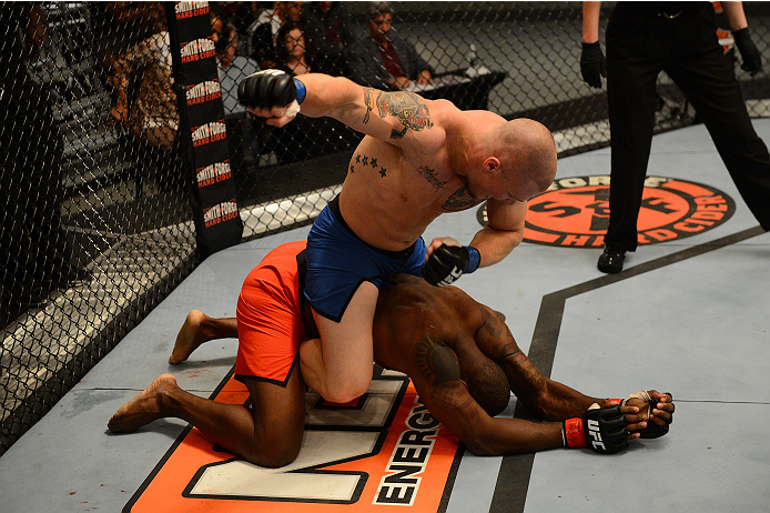 LAS VEGAS, NV - OCTOBER 16: (L-R) Jake Helin punches Todd Monaghan in their elimination fight during filming of season nineteen of The Ultimate Fighter on October 16, 2013 in Las Vegas, Nevada. (Photo by Al Powers/Zuffa LLC/Zuffa LLC via Getty Images) **