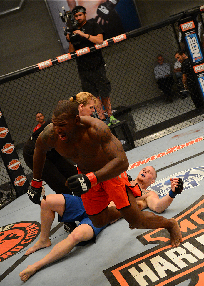 LAS VEGAS, NV - OCTOBER 16: (L-R) Todd Monaghan celebrates after submitting Jake Helin in their elimination fight during filming of season nineteen of The Ultimate Fighter on October 16, 2013 in Las Vegas, Nevada. (Photo by Al Powers/Zuffa LLC/Zuffa LLC