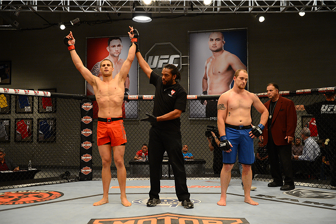 LAS VEGAS, NV - OCTOBER 16: (L-R) Matt Van Buren celebrates after defeating Daniel Vizcaya in their elimination fight during filming of season nineteen of The Ultimate Fighter on October 16, 2013 in Las Vegas, Nevada. (Photo by Al Powers/Zuffa LLC/Zuffa