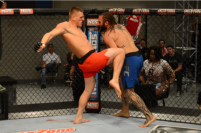 LAS VEGAS, NV - OCTOBER 16: (L-R) Anton Berzin lands a knee to the body of Cody Mumma in their elimination fight during filming of season nineteen of The Ultimate Fighter on October 16, 2013 in Las Vegas, Nevada. (Photo by Al Powers/Zuffa LLC/Zuffa LLC v
