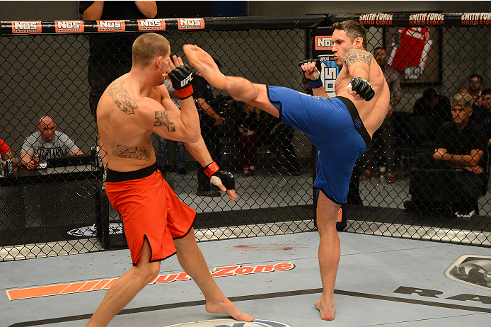 LAS VEGAS, NV - OCTOBER 16: (R-L) Chris Fields kicks Josh Stansbury in their elimination fight during filming of season nineteen of The Ultimate Fighter on October 16, 2013 in Las Vegas, Nevada. (Photo by Al Powers/Zuffa LLC/Zuffa LLC via Getty Images) *