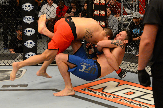 LAS VEGAS, NV - OCTOBER 16: (L-R) Josh Stansbury takes down Chris Fields in their elimination fight during filming of season nineteen of The Ultimate Fighter on October 16, 2013 in Las Vegas, Nevada. (Photo by Al Powers/Zuffa LLC/Zuffa LLC via Getty Imag