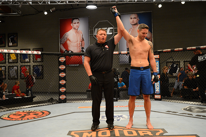 LAS VEGAS, NV - OCTOBER 16: Chris Fields celebrates after defeated Josh Stansbury in their elimination fight during filming of season nineteen of The Ultimate Fighter on October 16, 2013 in Las Vegas, Nevada. (Photo by Al Powers/Zuffa LLC/Zuffa LLC via G