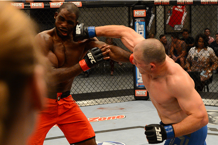 LAS VEGAS, NV - OCTOBER 16: (R-L) Kelly Anundson punches Corey Anderson in their elimination fight during filming of season nineteen of The Ultimate Fighter on October 16, 2013 in Las Vegas, Nevada. (Photo by Al Powers/Zuffa LLC/Zuffa LLC via Getty Image