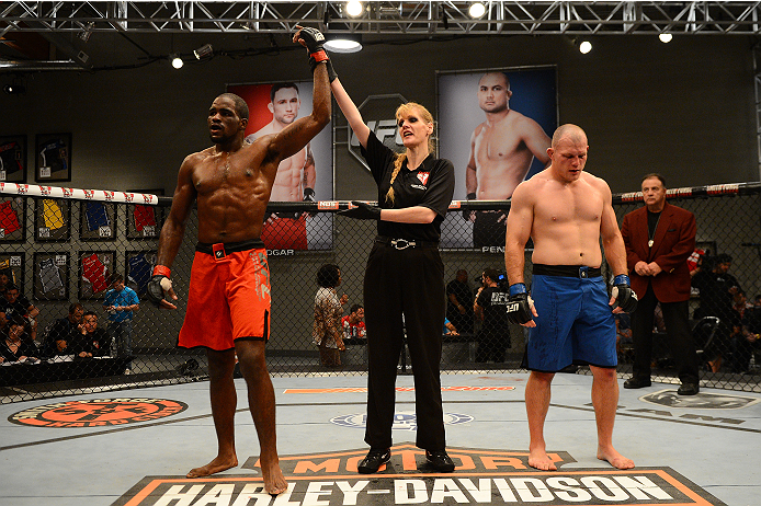 LAS VEGAS, NV - OCTOBER 16: (L-R) Corey Anderson celebrates after defeating Kelly Anundson in their elimination fight during filming of season nineteen of The Ultimate Fighter on October 16, 2013 in Las Vegas, Nevada. (Photo by Al Powers/Zuffa LLC/Zuffa