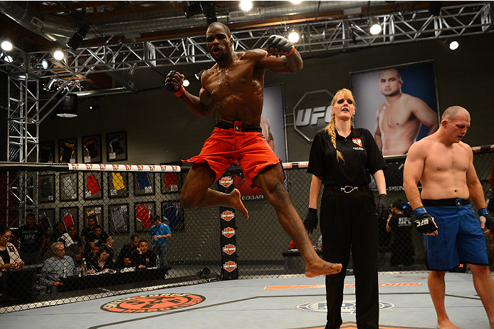 LAS VEGAS, NV - OCTOBER 16: (L-R) Corey Anderson celebrates after defeating Kelly Anundson in their elimination fight during filming of season nineteen of The Ultimate Fighter on October 16, 2013 in Las Vegas, Nevada. (Photo by Al Powers/Zuffa LLC/Zuffa