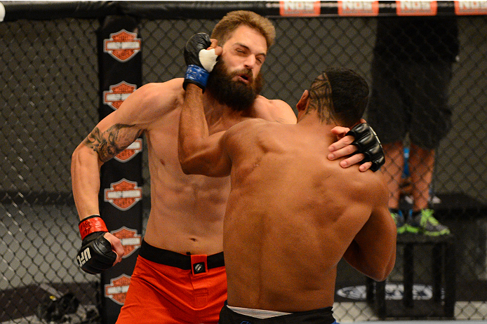 LAS VEGAS, NV - OCTOBER 16: (R-L) Dhiego Lima punches Adam Stroup in their elimination fight during filming of season nineteen of The Ultimate Fighter on October 16, 2013 in Las Vegas, Nevada. (Photo by Al Powers/Zuffa LLC/Zuffa LLC via Getty Images) ***