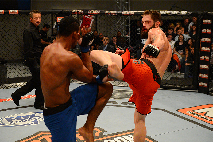 LAS VEGAS, NV - OCTOBER 16: (R-L) Adam Stroup kicks Dhiego Lima in their elimination fight during filming of season nineteen of The Ultimate Fighter on October 16, 2013 in Las Vegas, Nevada. (Photo by Al Powers/Zuffa LLC/Zuffa LLC via Getty Images) *** L