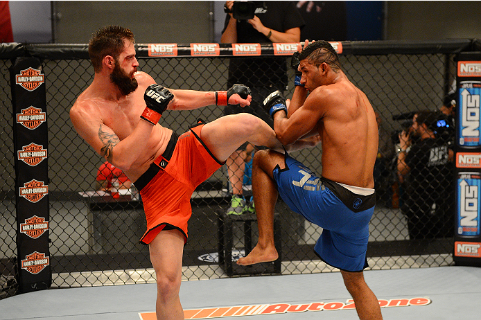 LAS VEGAS, NV - OCTOBER 16: (R-L) Dhiego Lima blocks a kick from Adam Stroup in their elimination fight during filming of season nineteen of The Ultimate Fighter on October 16, 2013 in Las Vegas, Nevada. (Photo by Al Powers/Zuffa LLC/Zuffa LLC via Getty