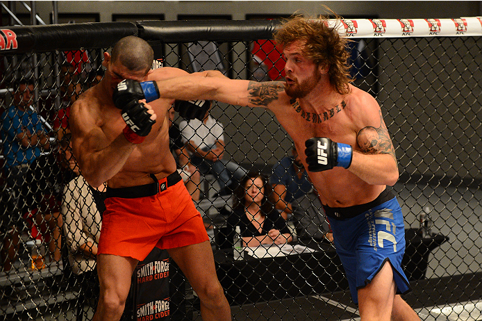 LAS VEGAS, NV - OCTOBER 16: (R-L) Mike King punches Nordine Taleb in their elimination fight during filming of season nineteen of The Ultimate Fighter on October 16, 2013 in Las Vegas, Nevada. (Photo by Al Powers/Zuffa LLC/Zuffa LLC via Getty Images) ***