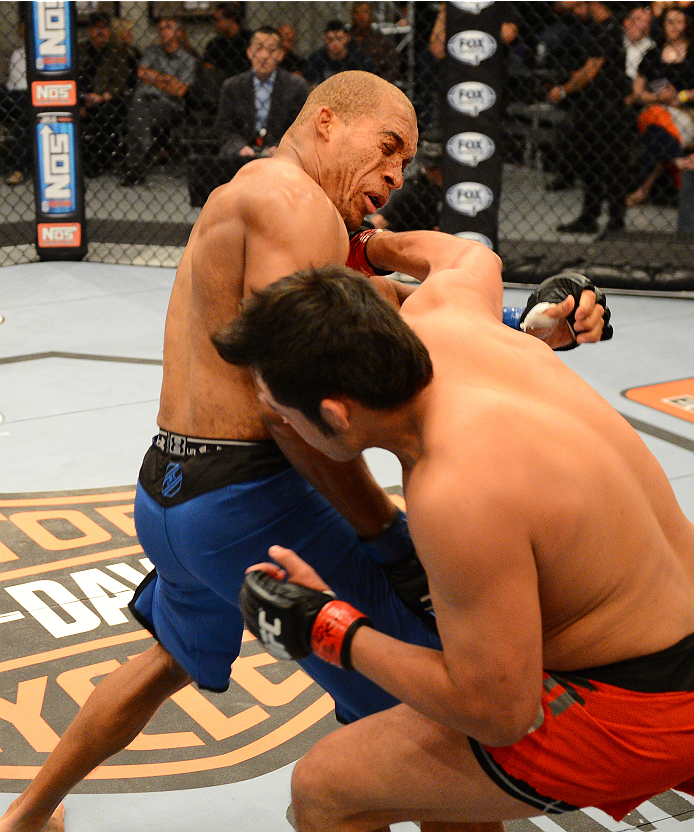 LAS VEGAS, NV - OCTOBER 16: (R-L) Hector Urbina punches Adrian Miles in their elimination fight during filming of season nineteen of The Ultimate Fighter on October 16, 2013 in Las Vegas, Nevada. (Photo by Al Powers/Zuffa LLC/Zuffa LLC via Getty Images)