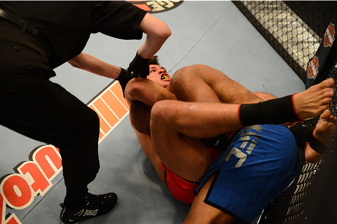 LAS VEGAS, NV - OCTOBER 16: (L-R) Hector Urbina submits Adrian Miles in their elimination fight during filming of season nineteen of The Ultimate Fighter on October 16, 2013 in Las Vegas, Nevada. (Photo by Al Powers/Zuffa LLC/Zuffa LLC via Getty Images)