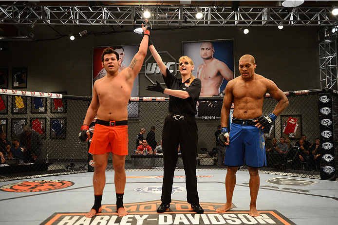 LAS VEGAS, NV - OCTOBER 16: (L-R) Hector Urbina celebrates after defeating Adrian Miles in their elimination fight during filming of season nineteen of The Ultimate Fighter on October 16, 2013 in Las Vegas, Nevada. (Photo by Al Powers/Zuffa LLC/Zuffa LLC