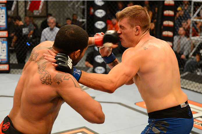 LAS VEGAS, NV - OCTOBER 16: (L-R) Roger Zapata punches Tyler Minton in their elimination fight during filming of season nineteen of The Ultimate Fighter on October 16, 2013 in Las Vegas, Nevada. (Photo by Al Powers/Zuffa LLC/Zuffa LLC via Getty Images) *