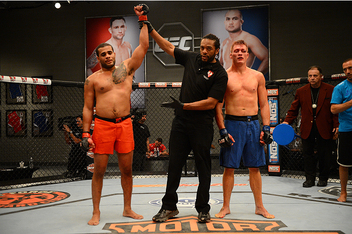 LAS VEGAS, NV - OCTOBER 16: (L-R) Roger Zapata celebrates after defeating Tyler Minton in their elimination fight during filming of season nineteen of The Ultimate Fighter on October 16, 2013 in Las Vegas, Nevada. (Photo by Al Powers/Zuffa LLC/Zuffa LLC
