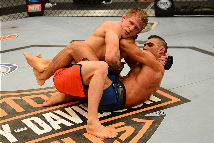 LAS VEGAS, NV - OCTOBER 16: (L-R) Joseph Stephens takes down Lyman Good in their elimination fight during filming of season nineteen of The Ultimate Fighter on October 16, 2013 in Las Vegas, Nevada. (Photo by Al Powers/Zuffa LLC/Zuffa LLC via Getty Image