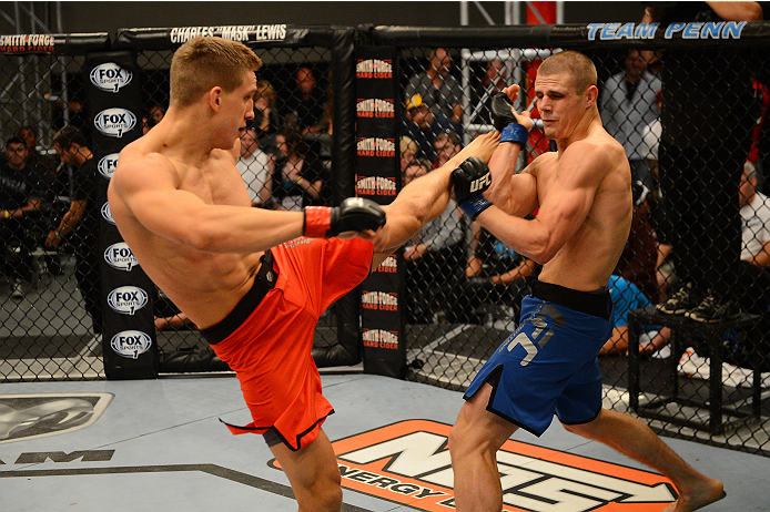 LAS VEGAS, NV - OCTOBER 16: (L-R) Bojan Velickovic kicks Tim Williams in their elimination fight during filming of season nineteen of The Ultimate Fighter on October 16, 2013 in Las Vegas, Nevada. (Photo by Al Powers/Zuffa LLC/Zuffa LLC via Getty Images)