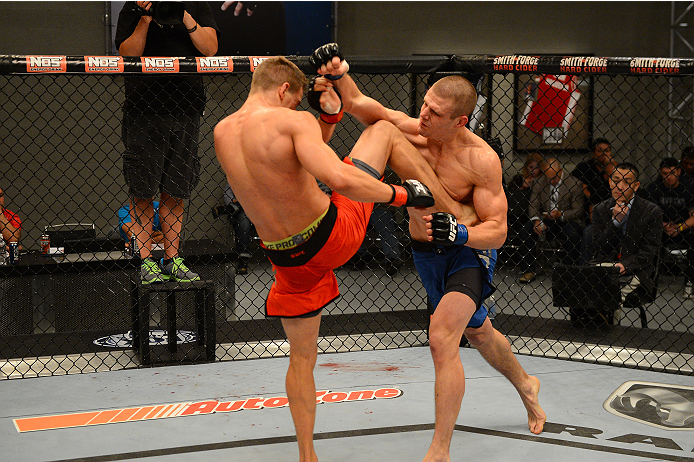LAS VEGAS, NV - OCTOBER 16: (L-R) Bojan Velickovic kicks Tim Williams in their elimination fight during filming of season nineteen of The Ultimate Fighter on October 16, 2013 in Las Vegas, Nevada. (Photo by Al Powers/Zuffa LLC/Zuffa LLC via Getty Images)
