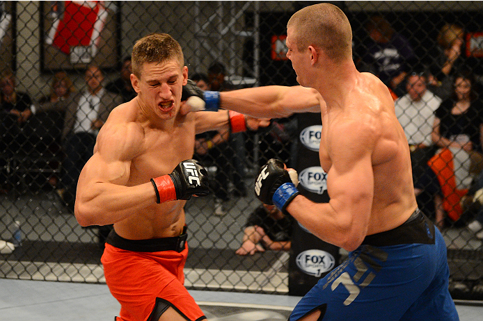 LAS VEGAS, NV - OCTOBER 16: (R-L) Tim Williams punches Bojan Velickovic in their elimination fight during filming of season nineteen of The Ultimate Fighter on October 16, 2013 in Las Vegas, Nevada. (Photo by Al Powers/Zuffa LLC/Zuffa LLC via Getty Image