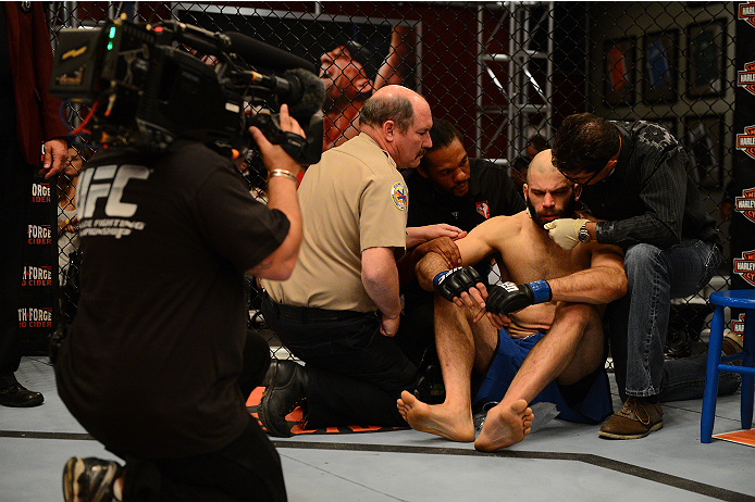 LAS VEGAS, NV - OCTOBER 16: Tyler King is attended to by medical staff after getting knocked out by Daniel Spohn in their elimination fight during filming of season nineteen of The Ultimate Fighter on October 16, 2013 in Las Vegas, Nevada. (Photo by Al Po