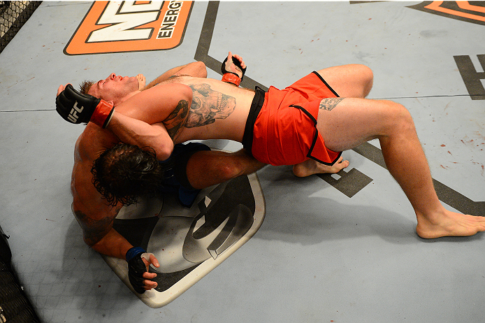 LAS VEGAS, NV - OCTOBER 16: (L-R) Josh Clark attempts to submit John Poppie in their elimination fight during filming of season nineteen of The Ultimate Fighter on October 16, 2013 in Las Vegas, Nevada. (Photo by Al Powers/Zuffa LLC/Zuffa LLC via Getty I