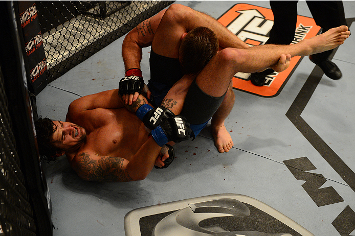 LAS VEGAS, NV - OCTOBER 16: (L-R) Josh Clark submits John Poppie in their elimination fight during filming of season nineteen of The Ultimate Fighter on October 16, 2013 in Las Vegas, Nevada. (Photo by Al Powers/Zuffa LLC/Zuffa LLC via Getty Images) ***
