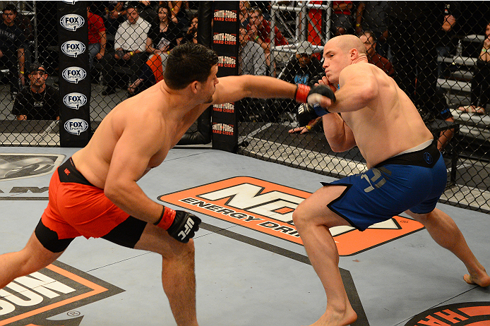 LAS VEGAS, NV - OCTOBER 16: (L-R) Patrick Walsh punches Doug Sparks in their elimination fight during filming of season nineteen of The Ultimate Fighter on October 16, 2013 in Las Vegas, Nevada. (Photo by Al Powers/Zuffa LLC/Zuffa LLC via Getty Images) *