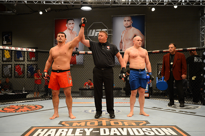 LAS VEGAS, NV - OCTOBER 16: (L-R) Patrick Walsh celebrates after defeating faces Doug Sparks in their elimination fight during filming of season nineteen of The Ultimate Fighter on October 16, 2013 in Las Vegas, Nevada. (Photo by Al Powers/Zuffa LLC/Zuff