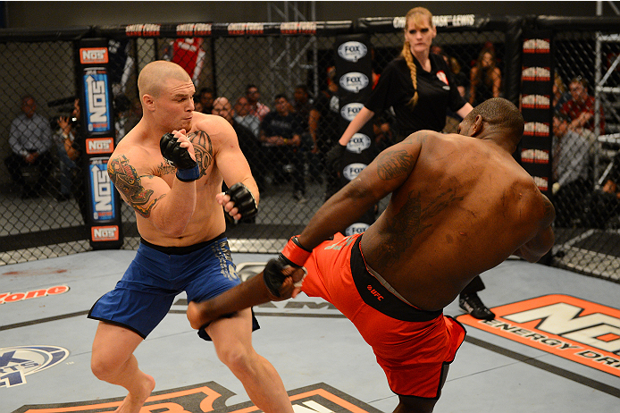 LAS VEGAS, NV - OCTOBER 16: (R-L) Todd Monaghan kicks Jake Helin in their elimination fight during filming of season nineteen of The Ultimate Fighter on October 16, 2013 in Las Vegas, Nevada. (Photo by Al Powers/Zuffa LLC/Zuffa LLC via Getty Images) ***