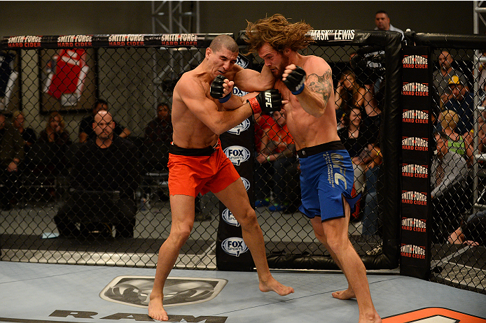 LAS VEGAS, NV - OCTOBER 16: (R-L) Mike King and Nordine Taleb exchange punches in their elimination fight during filming of season nineteen of The Ultimate Fighter on October 16, 2013 in Las Vegas, Nevada. (Photo by Al Powers/Zuffa LLC/Zuffa LLC via Gett