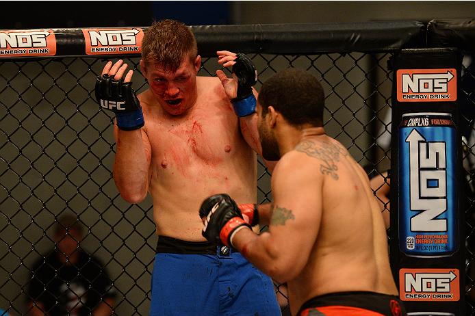 LAS VEGAS, NV - OCTOBER 16: (R-L) Roger Zapata punches Tyler Minton in their elimination fight during filming of season nineteen of The Ultimate Fighter on October 16, 2013 in Las Vegas, Nevada. (Photo by Al Powers/Zuffa LLC/Zuffa LLC via Getty Images) *