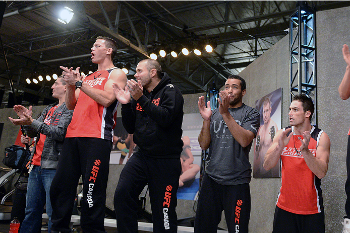 LACHUTE, CANADA - NOVEMBER 5: Team Canada cheers on fighter Elias Theodorou before his middleweight bout against team Australia fighter Zein Saliba during filming of The Ultimate Fighter Nations television series on November 5, 2013 in Lachute, Quebec, C