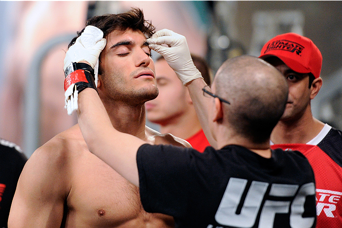 LACHUTE, CANADA - NOVEMBER 5: Team Canada fighter Elias Theodorou prepares to enter the Octagon before his middleweight bout against Team Australia fighter Zein Saliba during filming of The Ultimate Fighter Nations television series on November 5, 2013 i