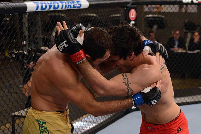 LACHUTE, CANADA - NOVEMBER 5: (L-R) Team Australia fighter Zein Saliba takes on Team Canada fighter Elias Theodorou in their middleweight bout during filming of The Ultimate Fighter Nations television series on November 5, 2013 in Lachute, Quebec, Canada
