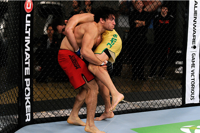 LACHUTE, CANADA - NOVEMBER 5: (L-R) Team Canada fighter Elias Theodorou attempts a takedown against Team Australia fighter Zein Saliba in their middleweight bout during filming of The Ultimate Fighter Nations television series on November 5, 2013 in Lach