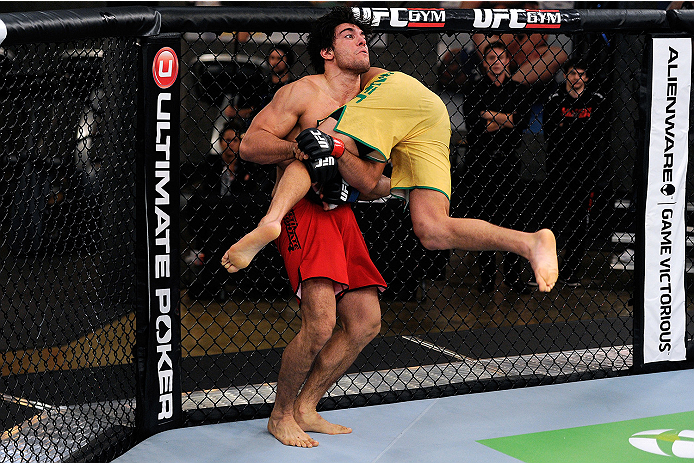 LACHUTE, CANADA - NOVEMBER 5: (L-R) Team Canada fighter Elias Theodorou attempts a takedown against Team Australia fighter Zein Saliba in their middleweight bout during filming of The Ultimate Fighter Nations television series on November 5, 2013 in Lach