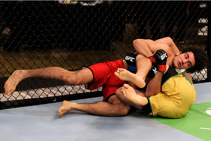 LACHUTE, CANADA - NOVEMBER 5: (L-R) Team Canada fighter Elias Theodorou attempts a takedown against Team Australia fighter Zein Saliba in their middleweight bout during filming of The Ultimate Fighter Nations television series on November 5, 2013 in Lach