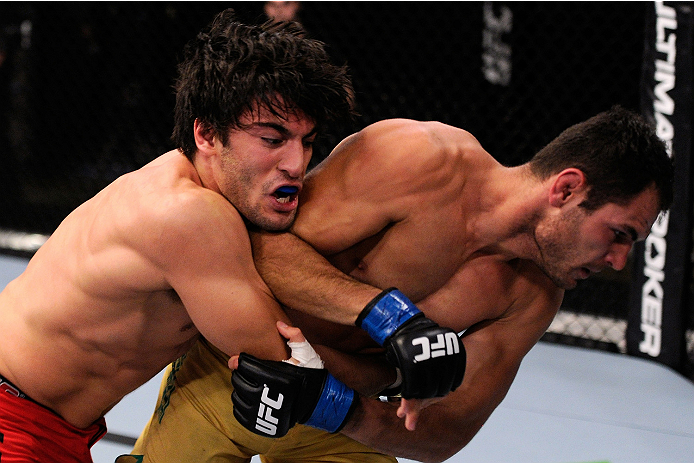 LACHUTE, CANADA - NOVEMBER 5: (L-R) Team Canada fighter Elias Theodorou takes down Team Australia fighter Zein Saliba in their middleweight bout during filming of The Ultimate Fighter Nations television series on November 5, 2013 in Lachute, Quebec, Cana